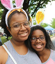 Thousands of people, including the Easter Bunny, stroll along Monument Avenue for what may be the final edition of Easter on Parade. Ogechi Mbagwu, 21, and her sister, Nasreen Mbagwu, 11, of Damascus, Md., show off the rabbit ears they donned for the Monument Avenue event.