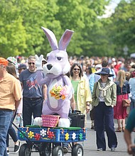 Thousands of people, including the Easter Bunny, stroll along Monument Avenue for what may be the final edition of Easter on Parade.