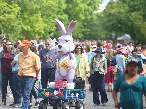 Thousands of people, including the Easter Bunny, stroll along Monument Avenue for what may be the final edition of Easter on Parade.