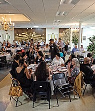 People from many different faiths and backgrounds participate in an interfaith Passover “Justice Seder” Monday evening, using the Exodus story and Passover rituals to shine a light on modern-day oppression of racism, sexism, militarism and materialism. The event was held at Temple Beth-El on Grove Avenue. (Sandra Sellars/Richmond Free Press)