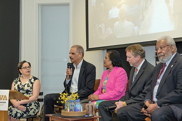 Former U.S. Attorney General Eric H. Holder, second from left, speaks during a civil rights panel discussion last Saturday honoring ...