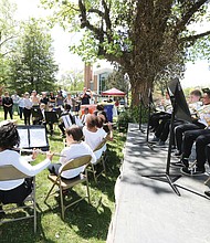 Joyful sounds: Members of the Linwood Holton Elementary School Band, led by Kendra Whindleton, perform for family, friends and supporters last Saturday at the 5th Annual Rosedale Cherry Blossom Festival at the Park at Christ Ascension Church on Laburnum Avenue in North Side. The event was a fundraiser for arts in Richmond Public Schools. Participants enjoyed food trucks, music, arts and crafts and a silent auction. (Regina H. Boone/Richmond Free Press)