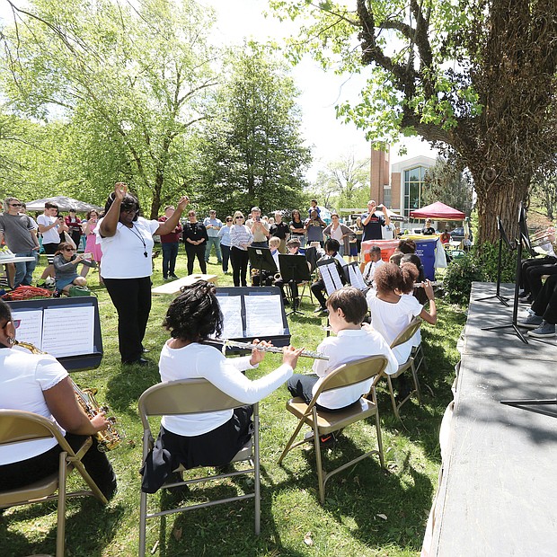 Joyful sounds: Members of the Linwood Holton Elementary School Band, led by Kendra Whindleton, perform for family, friends and supporters last Saturday at the 5th Annual Rosedale Cherry Blossom Festival at the Park at Christ Ascension Church on Laburnum Avenue in North Side. The event was a fundraiser for arts in Richmond Public Schools. Participants enjoyed food trucks, music, arts and crafts and a silent auction. (Regina H. Boone/Richmond Free Press)
