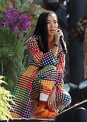 Performer Jhené Aiko plays to the  audience.