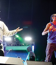 “Something in the Water” is the brainchild of Virginia Beach native Pharrell Williams, left, who performed Saturday under the banner “Pharrell & Friends.” Here, he is joined on stage by Snoop Dogg.