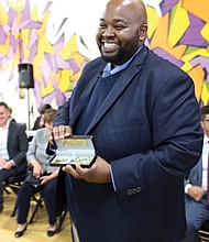 Award-winning teacher Rodney A. Robinson shows off the key to the City of Richmond presented to him by Mayor Levar M. Stoney during a ceremony last Thursday at the Virgie Binford Education Center inside the Richmond Juvenile Detention Center, where he teaches.