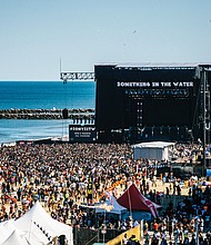 Thousands of people enjoy the entertainment on the main stage on the oceanfront at 5th Street in Virginia Beach. Tickets for the three-day festival ranged from $150 to $450. Organizers said they would refund 33 percent of the base price to purchasers after Friday’s scheduled concert was canceled because of stormy weather.