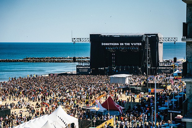 Thousands of people enjoy the entertainment on the main stage on the oceanfront at 5th Street in Virginia Beach. Tickets for the three-day festival ranged from $150 to $450. Organizers said they would refund 33 percent of the base price to purchasers after Friday’s scheduled concert was canceled because of stormy weather.