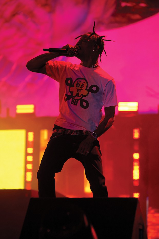 Performer Travis Scott plays to the  audience.