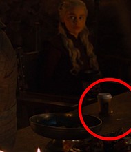 A coffee cup on a table in the great hall of Winterfell in the fictional, very coffee-less realm of Westeros.