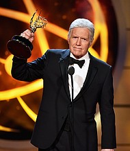 Alex Trebek accepts the Daytime Emmy Award for Outstanding Game Show Host onstage during the 46th annual Daytime Emmy Awards at Pasadena Civic Center on Sunday in Pasadena, California.