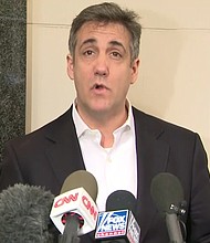 Michael Cohen speaks to reporters before he begins his three-year sentence in federal prison.