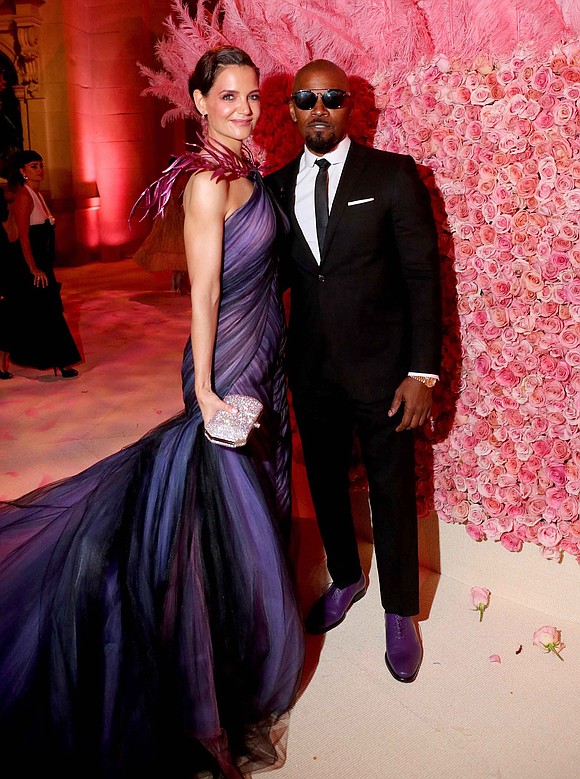 At the very least Katie Holmes and Jamie Foxx pose well together.