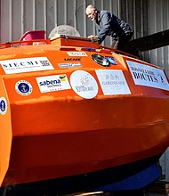 A French man who has spent more than four months floating across the Atlantic Ocean in a giant orange barrel has arrived at his Caribbean destination.