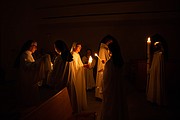 Nuns and guests at Our Lady of the Angels light candles during Easter Vigil Mass at the monastery in Crozet.