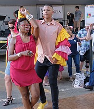 ¿Que Pasa? Festival: The food, music and art of Virginia’s Latino communities were in the spotlight last Saturday at the 2019 ¿Que Pasa? Festival, sponsored by the Hispanic Chamber of Commerce along the Riverfront Canal Walk in Shockoe Slip. Right, couples dance to the rhythms of Latin music, while festivalgoers, below, line up for boat rides along the canal in vessels decorated like the boats in Xochimilco, Mexico.