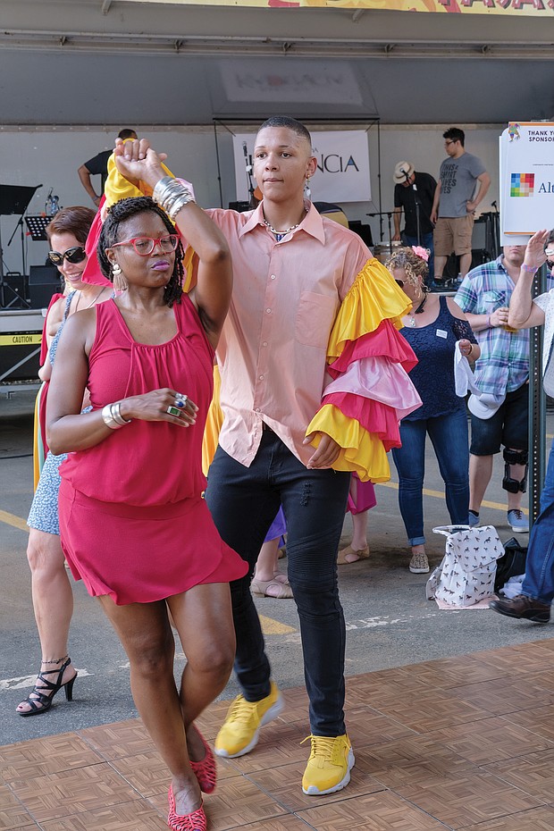 ¿Que Pasa? Festival: The food, music and art of Virginia’s Latino communities were in the spotlight last Saturday at the 2019 ¿Que Pasa? Festival, sponsored by the Hispanic Chamber of Commerce along the Riverfront Canal Walk in Shockoe Slip. Right, couples dance to the rhythms of Latin music, while festivalgoers, below, line up for boat rides along the canal in vessels decorated like the boats in Xochimilco, Mexico.