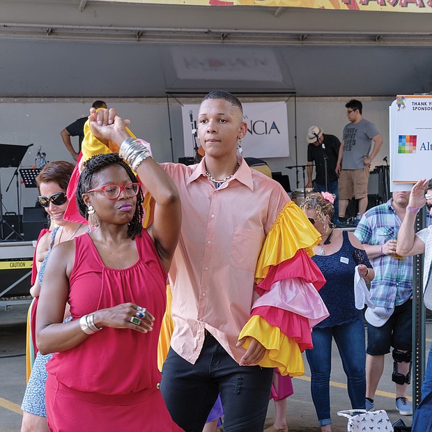 ¿Que Pasa? Festival: The food, music and art of Virginia’s Latino communities were in the spotlight last Saturday at the 2019 ¿Que Pasa? Festival, sponsored by the Hispanic Chamber of Commerce along the Riverfront Canal Walk in Shockoe Slip. Right, couples dance to the rhythms of Latin music, while festivalgoers, below, line up for boat rides along the canal in vessels decorated like the boats in Xochimilco, Mexico.