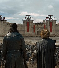 (From left to right) Ser Davos, Jon Snow, and Tyrion Lannister look towards the gates of King's Landing before the Last War.