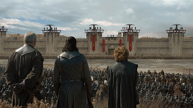 (From left to right) Ser Davos, Jon Snow, and Tyrion Lannister look towards the gates of King's Landing before the Last War.