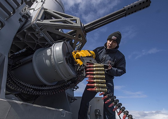 Fire Controlman 1st Class Alexander Perez, from Houston, reloads a phalanx close-in weapons system aboard the Arleigh Burke-class guided-missile destroyer …