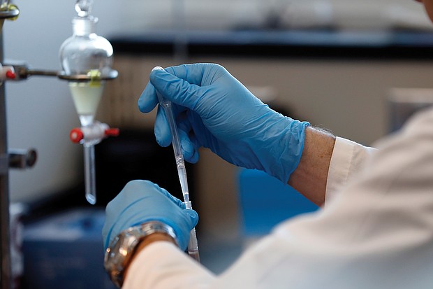 In this December 2018 photo, forensic scientist group supervisor Arthur Christy tests evidence for the presence of controlled substances at the Virginia Department of Forensic Science’s Eastern Laboratory in Norfolk.