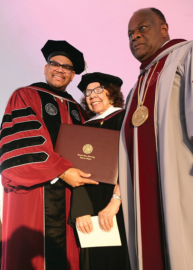 Barbara Radcliffe Grey, a VUU alumna and longtime director of the VUU Museum Art Galleries, is presented with an honorary degree from VUU President Hakim J. Lucas, left, and Dr. W. Franklyn Richardson, chairman of the VUU Board of Trustees.