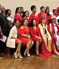 Bishop Phoebe Roaf, holding the crosier, pauses for a photo with a contingent from St. Philip’s Episcopal Church in Richmond following her consecration May 4 as bishop of West Tennessee. Seated next to Bishop Roaf is retired Bishop Shannon Johnston of the Diocese of Virginia.  (photo courtesy of St. Phillip's Episcopal Church)