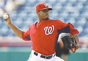 Pitcher Edwin Jackson may need to glance at the front of his jersey to remind himself which Major League Baseball ...