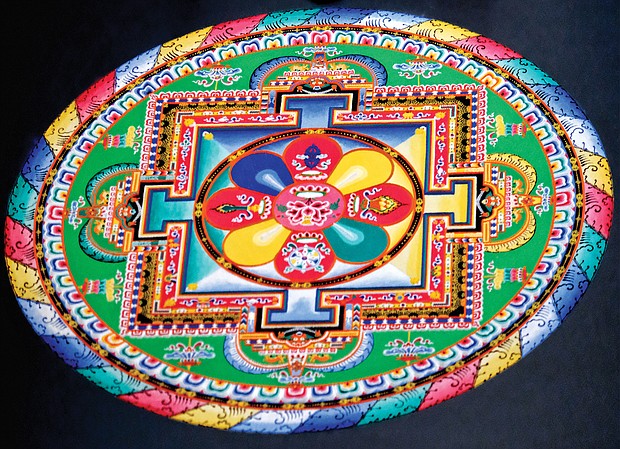 Mandala: Sacred art/Tibetan Buddhist monks from the Drepung Loseling Monastery in India create a sand mandala at the Virginia Museum of Fine Arts recently to share Tibet’s sacred visual and performing arts with area audiences. The monks’ work, created over four days, was completed in conjunction with the VMFA’s new exhibit, “Awaken: A Tibetan Buddhist Journey Toward Enlightenment,” that features roughly 100 historical and contemporary objects highlighting the role of art in Tibetan Buddhist culture and religious practices. (Sandra Sellars/Richmond Free Press)