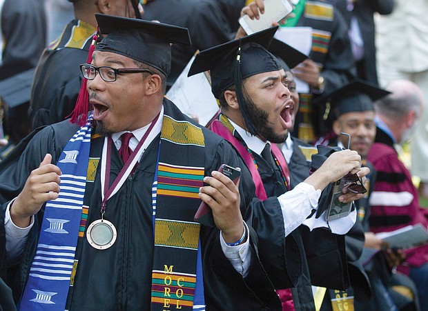 Shocked graduates, above, stand and cheer after commencement speaker billionaire technology investor and philanthropist Robert F. Smith, right, announces his family will provide a grant to eliminate the student debt of Morehouse College’s entire 2019 graduating class, a gift valued at roughly $40 million.