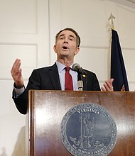 After apologizing a day earlier, the governor backpedals during a Feb. 2 news conference at the Executive Mansion, saying that he is neither person in the racist photo on his yearbook page. However, he admitted during the news conference that he wore blackface to portray superstar Michael Jackson during a 1984 dance contest. First Lady Pam Northam listened in the background.