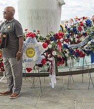 Celebrations of remembrance on Memorial Weekend/
Chuck Talley, a Vietnam War veteran and member of American Legion Post 144 Battlefields in Highland Springs, pauses during the prayer after all the wreaths have been placed honoring the men and women who gave their lives defending the nation from the Revolutionary War through today. (Ava Reaves/Richmond Free Press)