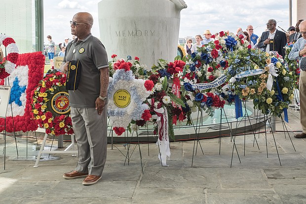 Celebrations of remembrance on Memorial Weekend/
Chuck Talley, a Vietnam War veteran and member of American Legion Post 144 Battlefields in Highland Springs, pauses during the prayer after all the wreaths have been placed honoring the men and women who gave their lives defending the nation from the Revolutionary War through today. (Ava Reaves/Richmond Free Press)