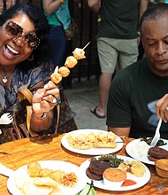 Broad Appétit dishes out food, fun
Thousands turned out to sample the offerings of 60 plus Richmond area chefs at the 12th edition of Broad Appétit, a food festival like no other. Beverly and Gary Claiborne of Glen Allen feast. 
Sunday’s event once again created a palate-tickling paradise in four blocks of Broad Street between Adams and Henry streets in Downtown. 
Participants ponied up $4 for each sample they taste-tested, with proceeds from the festive event benefiting FeedMore and the Central Virginia Food Bank. 
Along with mouth-watering treats, the event also featured live music and an art project for children. (Regina H. Boone)