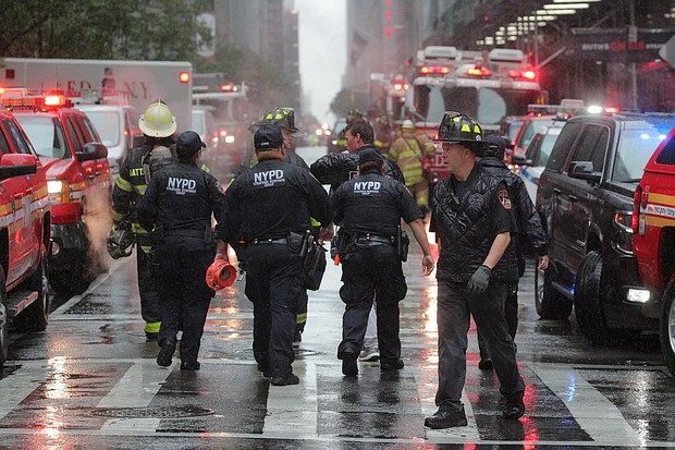 New York City police and firefighters arrive at the helicopter crash.