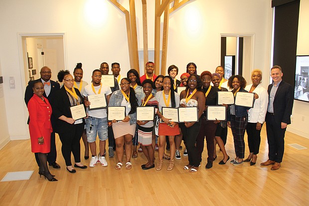 Armstrong High School’s top seniors show off the framed certificates they received at the school’s second annual scholars luncheon held June 4 at the Black History Museum and Cultural Center of Virginia. The 24 scholars all have GPAs of 3.0 or higher. Armstrong Principal Willie J. Bell also presented them with an academic achievement medal and a copy of the Dr. Seuss book, “Oh, the Places You’ll Go!” Armstrong seniors honored at the event: Tar’Quasia Bell, Laura Blackwell (valedictorian), Nia’Sha Burroughs, Alexis Burwell, Jamira Commander, Andromeda Cooper, Keshae Elliotte, Makiah Gayles, Alia Harris, Khaliq Harris, Talil Harvey, Jacob Heinrich, Andre Jackson, Shaijzuan Jones, Precious King, Kiera Lewis, Johnae Macklin-Terry, Kiaira McCray, Joi Miles, Sharnay Moore, Corvell Poag (salutatorian), Damon Robinson, Sameerah Seaman and De’Jah Waller.