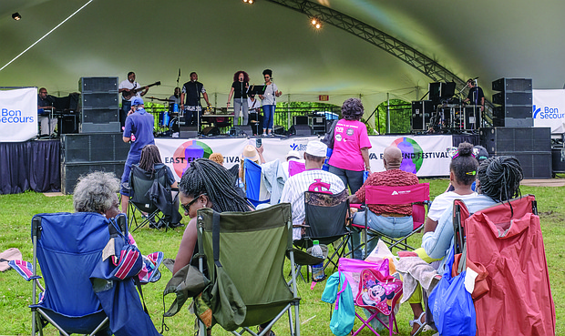 Richmond band Mahogany Soul entertains the crowd at Chimborazo Park last Saturday for the RVA East End Festival. The two-day, free event featured a broad range of musical groups — from Richmond Public Schools groups to the Richmond Symphony. This was the fourth year for the festival, which raises money through individual donations and corporate and foundation support to bolster music and arts programs in city schools in the East End. (Ava Reaves)