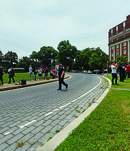 Neo-Confederates and counterprotesters face off on Monument Avenue at the statue of Confederate Robert E. Lee during competing rallies on June 1.