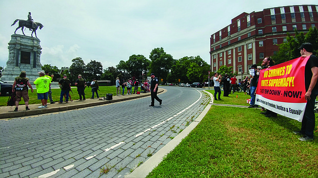 Neo-Confederates and counterprotesters face off on Monument Avenue at the statue of Confederate Robert E. Lee during competing rallies on June 1.