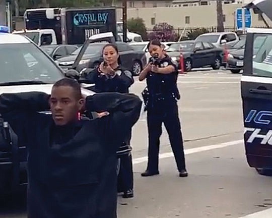 Clip Of Cops Aiming Guns At Black Man Kneeling With Hands Over Head Goes Viral Our Weekly