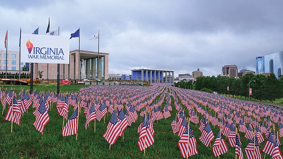 Nearly 12,000 flags fill the “Hill of Heroes” at the Virginia War Memorial on Belvidere Street. Planted by nearly 80 …