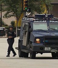 Dallas Police said that a suspect in an "active shooter incident" was shot during an exchange of gunfire with federal officers in downtown Dallas.