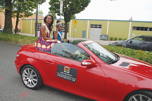Miss Juneteenth Oregon 2019 Aceia Spade and Little Miss Juneteenth 2019 RinaTchivandja, age 12, ride atop an open convertible.