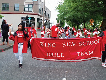 The King Sun School Drill Team marches in the Juneteenth Clara Peoples Freedom Trail Parade.