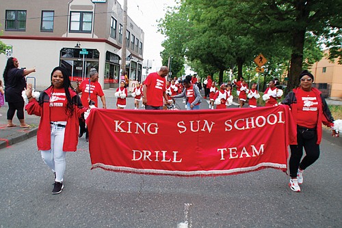 The King Sun School Drill Team marches in the Juneteenth Clara Peoples Freedom Trail Parade.