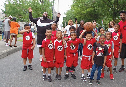 Portland’s North Star championship basketball team marches in honor.
