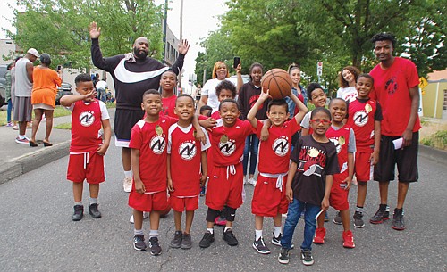 Portland’s North Star championship basketball team marches in honor.
