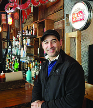 Jovanis Bouargoub (pictured) owns Red Fish Bleu Fish and Pork Chop in Hyde Park which he recently just combined into one building at 5121 S. Harper Ave. to begin fulfilling his vision of creating a small food hall in the neighborhood. Photo Credit: Cindy Kurman