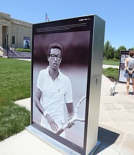 Photos of Richmond tennis star Arthur Ashe Jr. during his 1968 victory at the U.S. Open line the front sidewalk of the Virginia Museum of History & Culture at 428 N. Arthur Ashe Blvd. The installation, featuring rarely seen images of Mr. Ashe by LIFE magazine photographer John Zimmerman, is part of the celebration and dedication of Arthur Ashe Boulevard and will be on view until July 7. The installation was produced for the 2018 U.S. Open commemoration of the 50th anniversary of Mr. Ashe’s historic win.